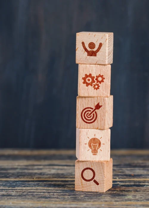 business-strategy-concept-with-wooden-cubes-wooden-grunge-background-side-view-2-scaled.webp